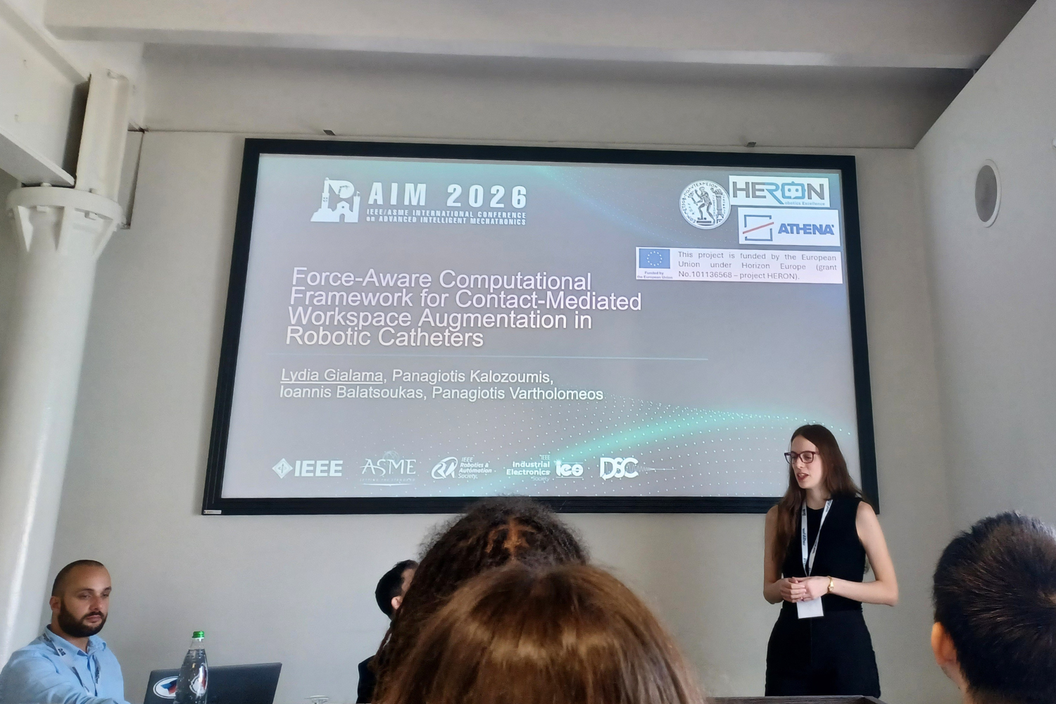 HERON researcher and PhD student at NTUA, Lydia Gialama, presenting research at AIM 2026 in Genova, Italy