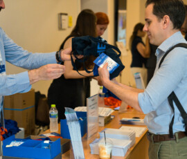 Participants receiving their conference badges and bags at the HRF Registration Desk